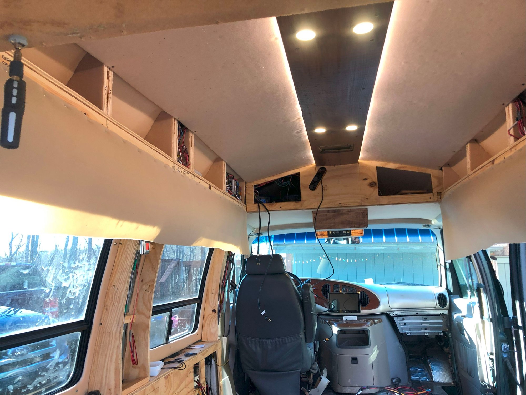 Headliner material stapled to cleat and ready to wrap down