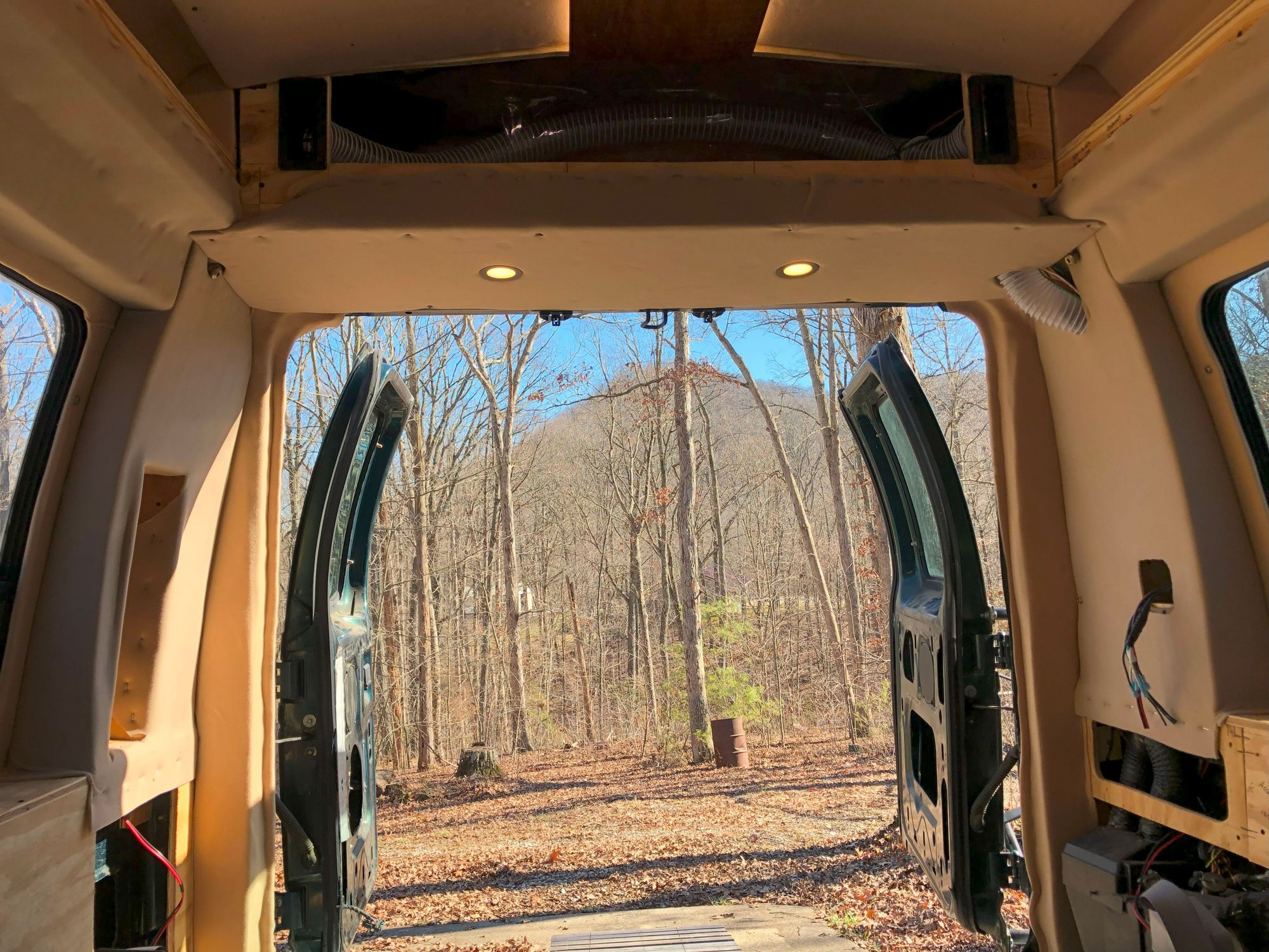 Rear headliner panel with lights installed