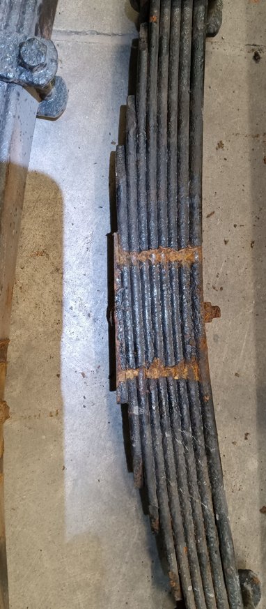 The tapered shim is built into the spring. I checked the manual and they said to put the thick end toward the rear. Thank for responding 