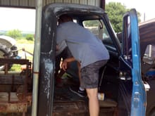 My brother and nephew tearing apart interior of the truck to assess the damage.