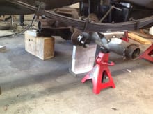 Ford Explorer rear axle housing with new spring perches and fabricated shock mounts.