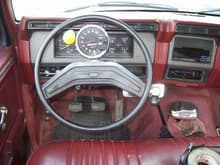 New interior. I put the tach and guage pod under the dash in. Added the B&amp;M shifter. The grey dash panels and chrome wipers and light knobs came out of an 84 f-150 explorer (i think, can't remember)