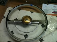 Steering Wheel...Anyone recognize what this is from, I could use some horn parts.