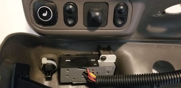 New switch mounted on seat control panel