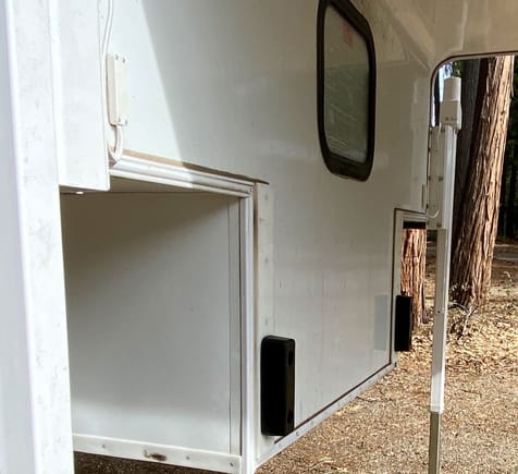 This snugs up to the front bed bulkhead with 1/2 inch clearance to the front lip, and 1 inch away from the truck taillights. With the cedar boards there is no change in attitude between truck and camper.