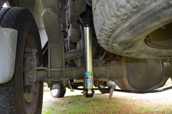 New rear shock. The boots on the front and rear shocks completely enclose the piston. There is no boot on the rear Ranchos and the front dust cover on the Ranchos is wide open at the bottom so all the road crud gets up inside the so called boot.