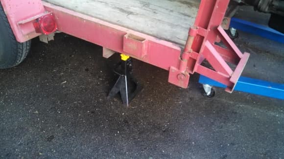 what do you mean the legs of the hoist wont clear the trailer rear end bottom side? 
"hold my beer and watch this" ...grabs jack and jack stands...