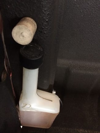 Stick the wire hook through the hole in the bed back by the tailgate, stick a wine bottle cork into the hole so the hook doesn't bounce out.