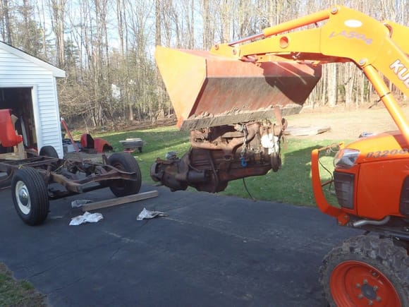 Ford truck engine removal with a neighbor's tractor.