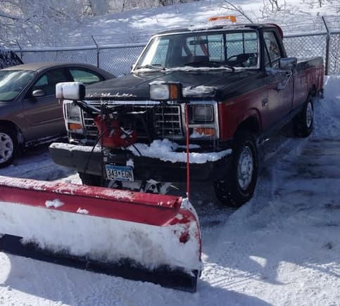 The plow truck, with a 90s bumper, roll bar, and 351