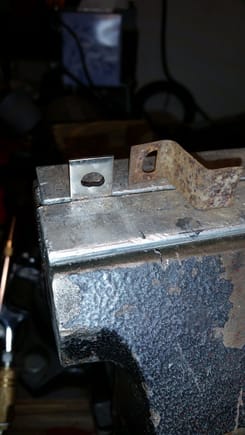 Found a piece of scrap metal in my bins the right width.  Cut it to length (bends considered) and filed the D-shaped hole. Not quite done in this pic.