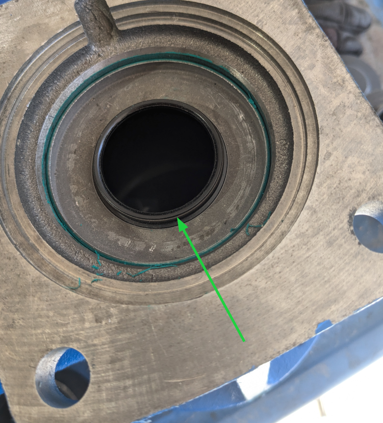 arrow pointing to the compression spring I am speaking of.  This is the transmission side of the tail shaft housing