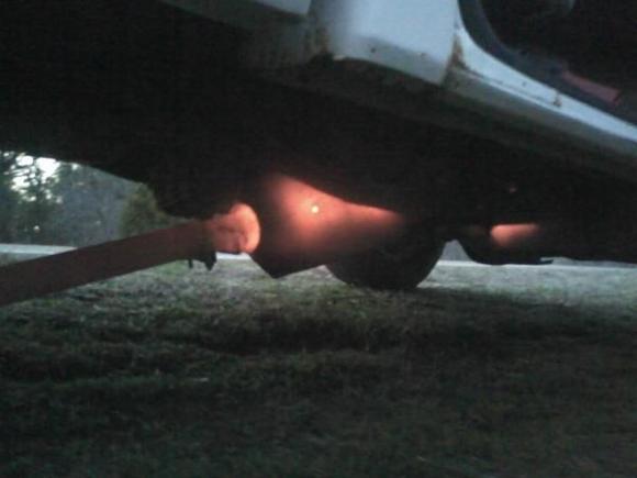 Both cats overheated and melted the rest of my exhaust. I took this picture from the side of the road when my truck broke down. I knew that I would not get another look at this when I pulled over. 
You can see the rear cat the best (on the left), and the tiny glow to the right of the picture is the front cat.