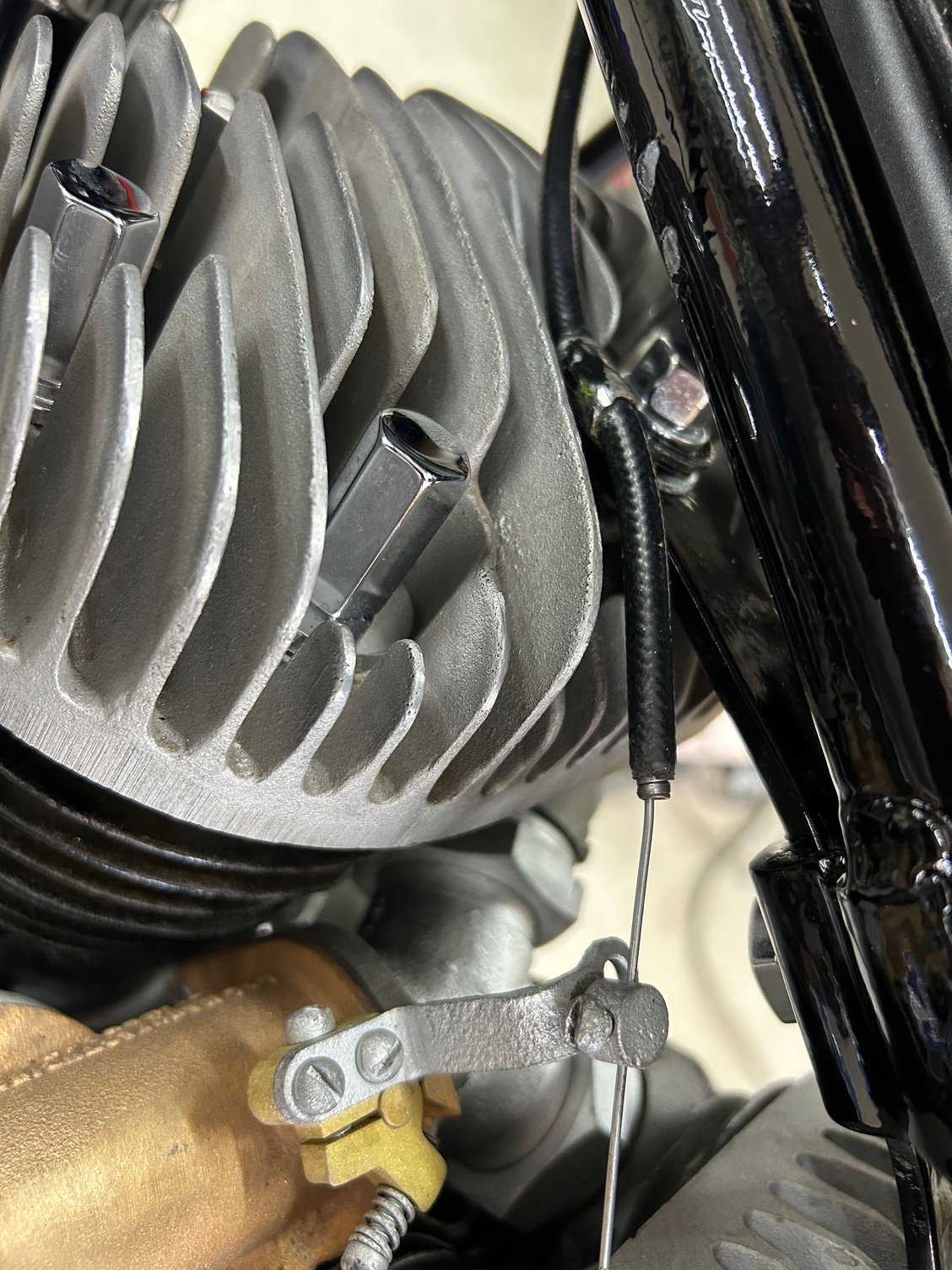 Well that didn't work putting the throttle cable on the head bolt like the military ones are ! Found out it goes on the tank bolt lower one .