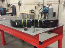 All laid out on the nice work surface. In order to run the upper tape line, I laid one on top of the other and taped straight across both. This would ensure that both fenders would be cut in roughly the same place.