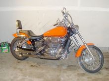 "Custom" attempt one: New paint, lowered in rear, 4" fork extensions, rear tail light/license plate shaved