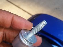 the new saddle bag connector bolt. its threaded, but I didn't bolt it all the way up. the handle points upward when you take it all the way up