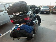 Here's a duffle bag with some wet beach towels under the cargo net drying out.
