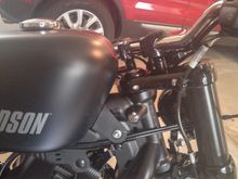 Here you can see the risers between the triple tree and the handlebar clamp. Just 1"...