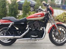 '08 XL1200R, Ohlins, Racetech fork springs, factory oil cooler, flyscreen, PM aircleaner, Khrome Werks slipons, dyno tuned. 2 tone paint in the style of the '57 Sportster. 