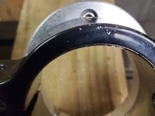 Screw hole for cowbell obscured by lower clamp.