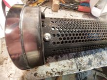 Vance and Hines Quiet Baffles go in VERY easy.  Holes are already there and come with the nuts.  Just screw em in. 