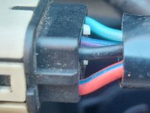 This is how the while plug is wired.  It is very easy to see which connections go where on the connector.  I am assuming the red/blue is power, black is ground....not sure of the teal and blue/purple wires. 