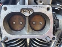 Magnetti Marelli throttle body showing bleed screws (top center)