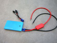 This is the Juno with the tender fitting off, (at top) and slightly plugged into the battery with the http://earthxbatteries.com/shop/20-l...p-start-cables.