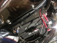 Connected to the battery with its fuse unit.