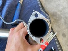 Incorrect logo orientation on front pipe (logo facing cylinder head)