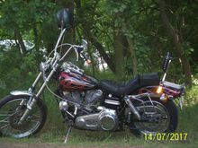 heres the left side . . .motor still has the original silver painted jugs . . .