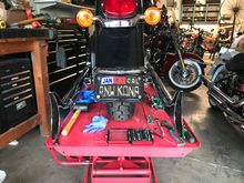Made a bracket that attaches to the inside of the fender support. Had to pull fender to drill it.