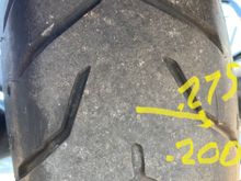 Measurements from surface of tire above the groove and below