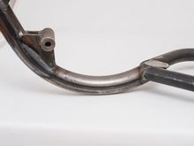 This is the feature that made me decide on this frame. Love that old-school loop under the motor. Sacrifice a bit of ground clearance, but I'm not going to be running this thing through the woods...