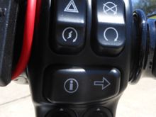 The right handlebar switch pack nopw includes a push-to-talk button for use with the CB.  It is a switch pack for prior '19 models, but works on the '19, but has the wrong symbol on Infotainment return button.  I know what it does so it does not bother me. BTW, the red wide is the power to my phone from the connection located inside the little cubby compartment. 

 