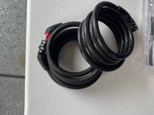 Lock cables, good for locking helmet with face gustd.