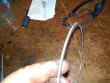 Spacer is stamped, sharp edges facing out. 