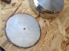 A sauce pan with another bottom cut out that will become the medallion portion.