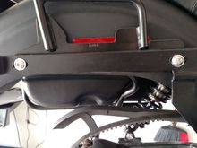 Not a great picture of the bag rails. They mount at the strut bolts and top shock mount. Kind of wish I had used different bolts so I didn't have to remove the bags to unbolt these.