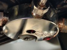 Hey guys, quick question. I have an L A Choppers brake fluid distribution block. about a month ago or longer I saw brake fluid leaking out of that very left fitting.(which faces the front of my bike) so I tightened it down. All good, no fluid at any of the three fittings. is it possible that while I was riding fluid transferred up above the distribution block and back through that center hole where the locating pin is. Because I have more fluid coming out of there after a month+.