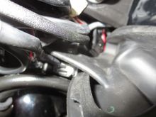 The rubber grommet in the frame with the connectors