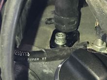 Oil return fitting with 1/2" hose attached to top of transmission