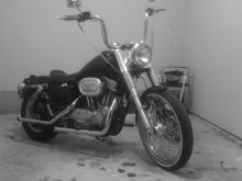 Sportster with fatboy front end, 21 inch wheel with white wall.