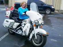 My wife standing with our 1996 Shriner Bike