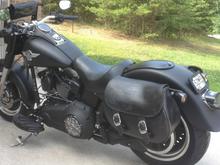 Windshield with pouch is handy, but I prefer the look of removing the windshield and using a fork bag above the headlight. Keeps the bike looking low, mean and fat.
