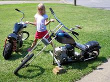 My daughter Harlie and her two mini-choppers (hand-built by me)