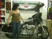 Mama posing In front of the new bike