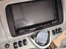 The round button on the left turns blue when reverse is activated.