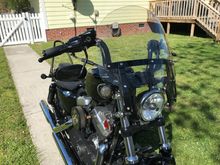 Added a HD quick release windshield to my 48. It really does a nice job cutting the wind without noticeable buffeting.  